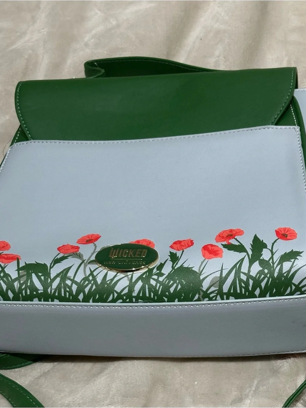 Green Illustrated Crossbody Bag with Gold Emblem